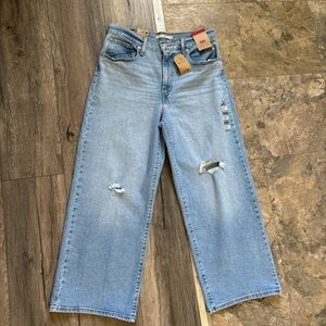 Women's Levi High Rise Light Blue Distressed Jeans